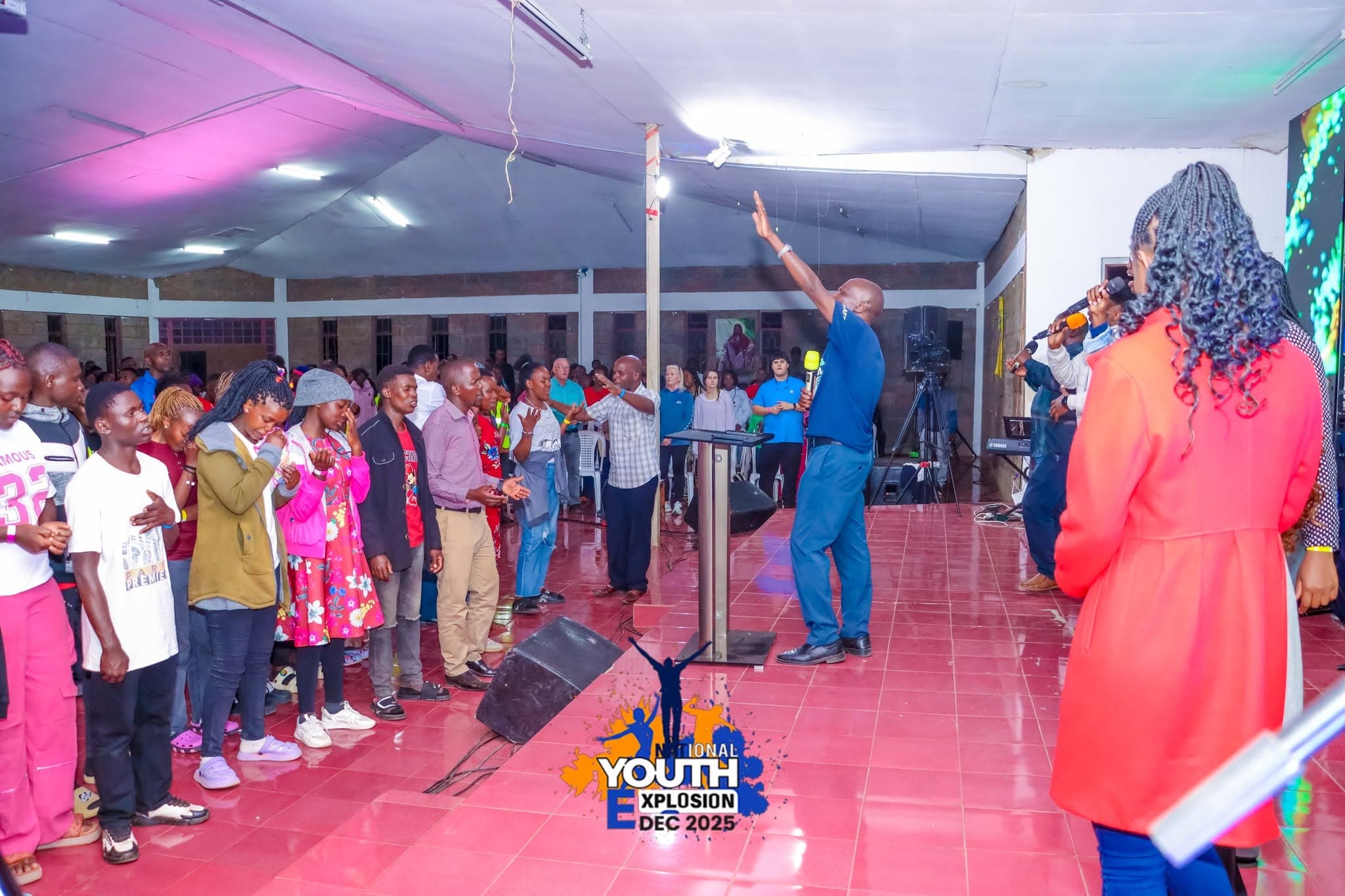 Young people gathered in worship at Youth Explosion